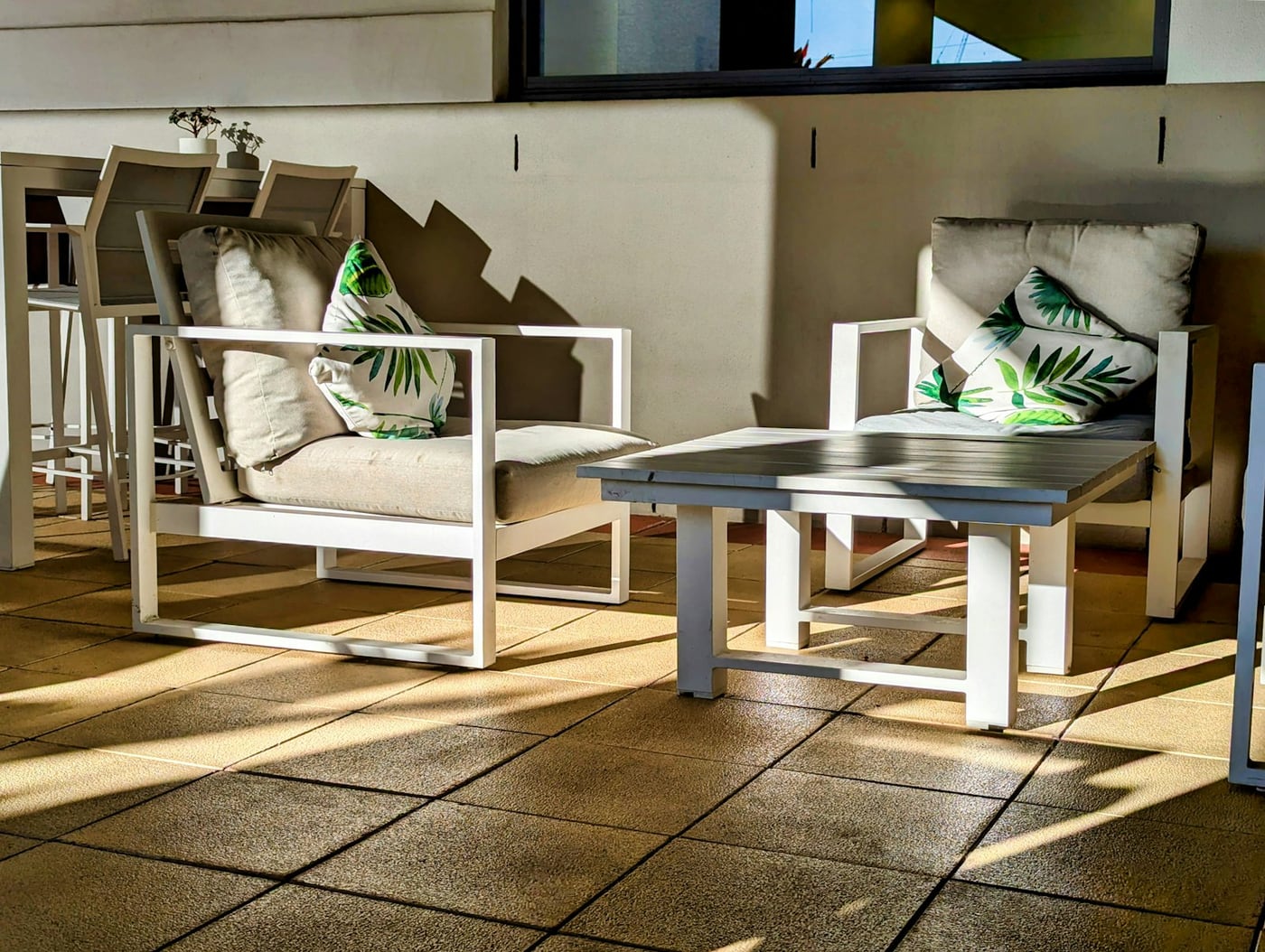 Two empty chairs in sunlight